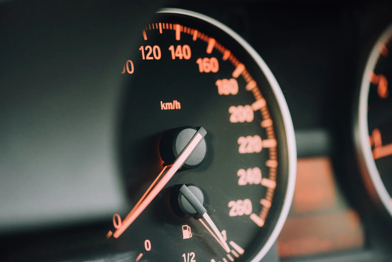 Illuminated dashboard instrument cluster showing warning lights