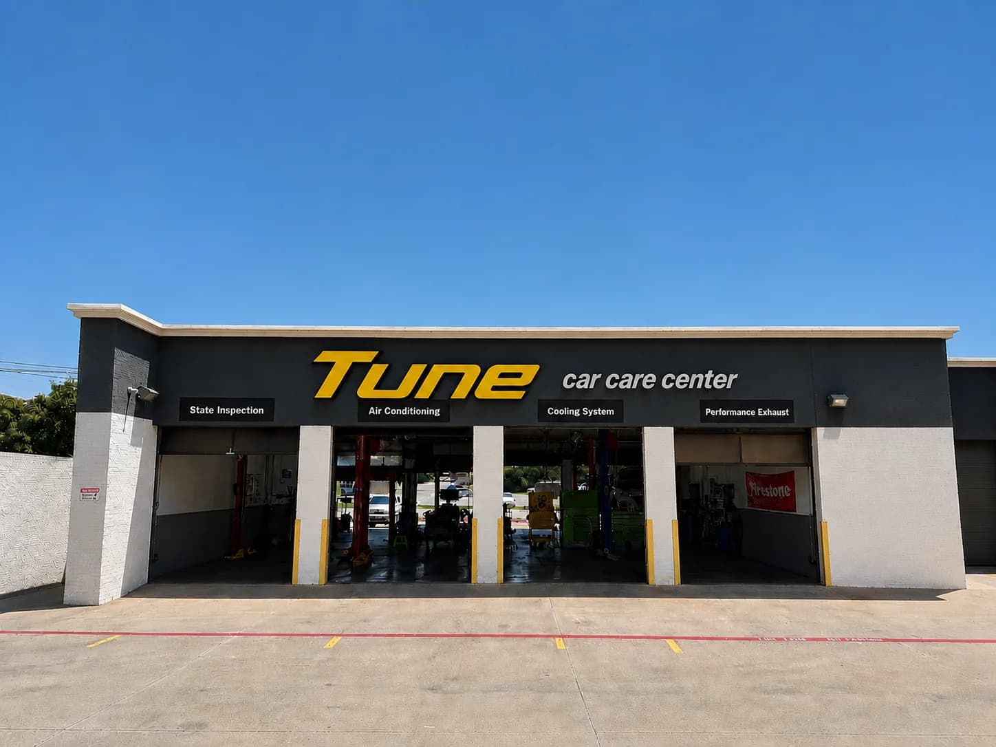 Open service bays with vehicles on lifts